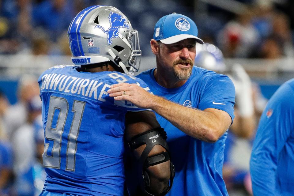 Detroit Lions head coach Dan Campbell hugs defensive end Levi Onwuzurike before the Atlanta Falcons game at Ford Field in Detroit on Sunday, Sept. 24, 2023.