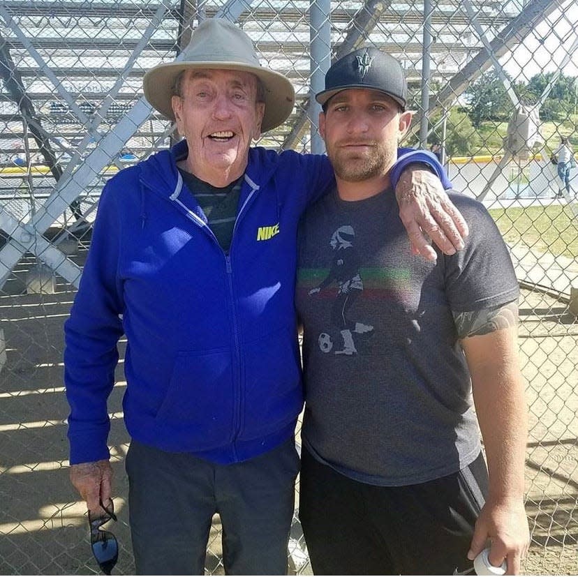 John Reardon poses with current Pacifica High coach Mike Moon. The former Rio Mesa head coach befriended Moon when he was a young coach at Rio Mesa.