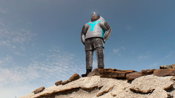 NASA's 'Technology' Z-2 spacesuit design is depicted on some rocks.