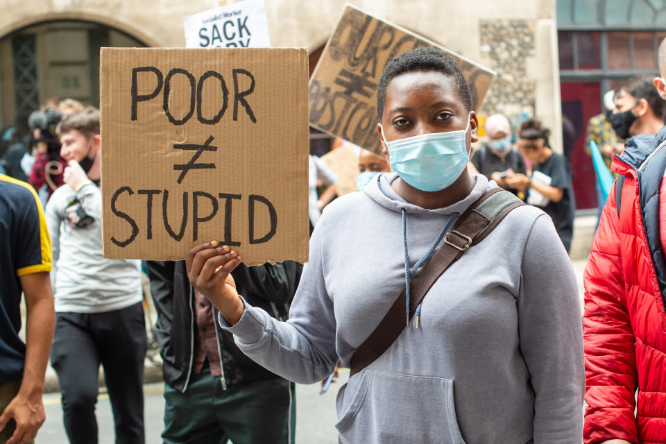 People take part in a protest marching from Downing Street to the Department of Education in Westminster, London, over the government's handling of A-level results. Thousands of pupils across England have expressed their disappointment at having their results downgraded after exams were cancelled due to coronavirus. Picture date: Friday August 14, 2020. Photo credit should read: Matt Crossick/Empics