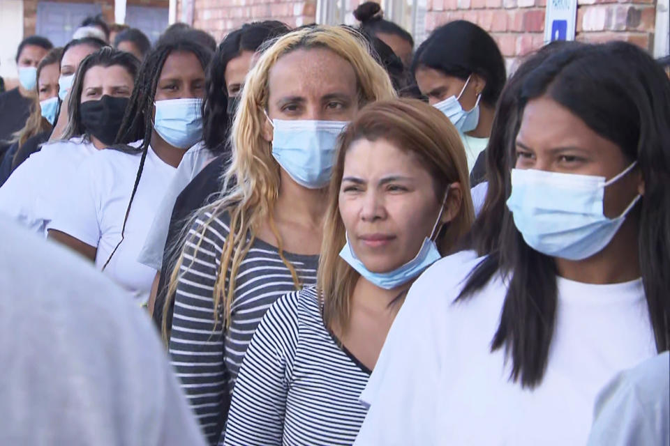 Migrants line up after having arrived by bus in El Paso, Texas, on Tuesday. (NBC News)