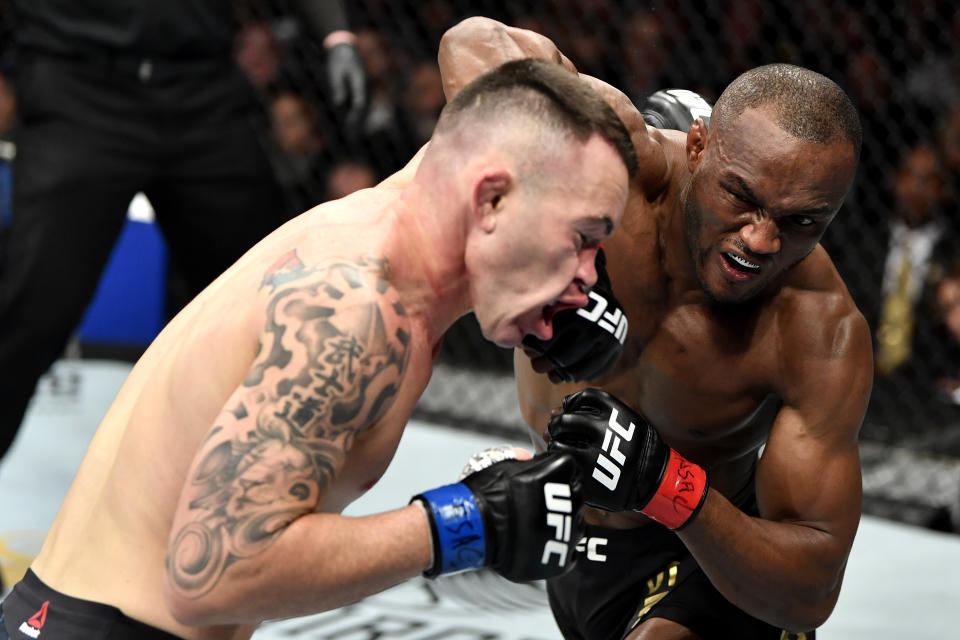 LAS VEGAS, NEVADA - DECEMBER 14:  (R-L) Kamaru Usman of Nigeria strikes Colby Covington in their UFC welterweight championship bout during the UFC 245 event at T-Mobile Arena on December 14, 2019 in Las Vegas, Nevada. (Photo by Jeff Bottari/Zuffa LLC via Getty Images)