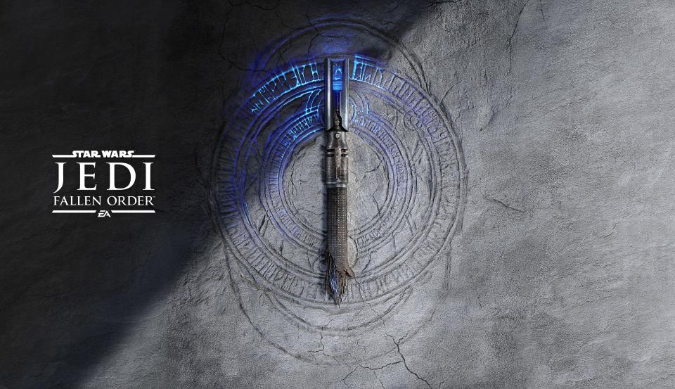 A lightsaber on what appears to be a rock face, with a logo that's made up of concentric circles beneath it.