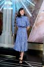 <p>On the day she is made UNICEFs youngest ever Goodwill Ambassador (in November 2018), Millie wears a checked shirt dress matched with a black belt. </p>