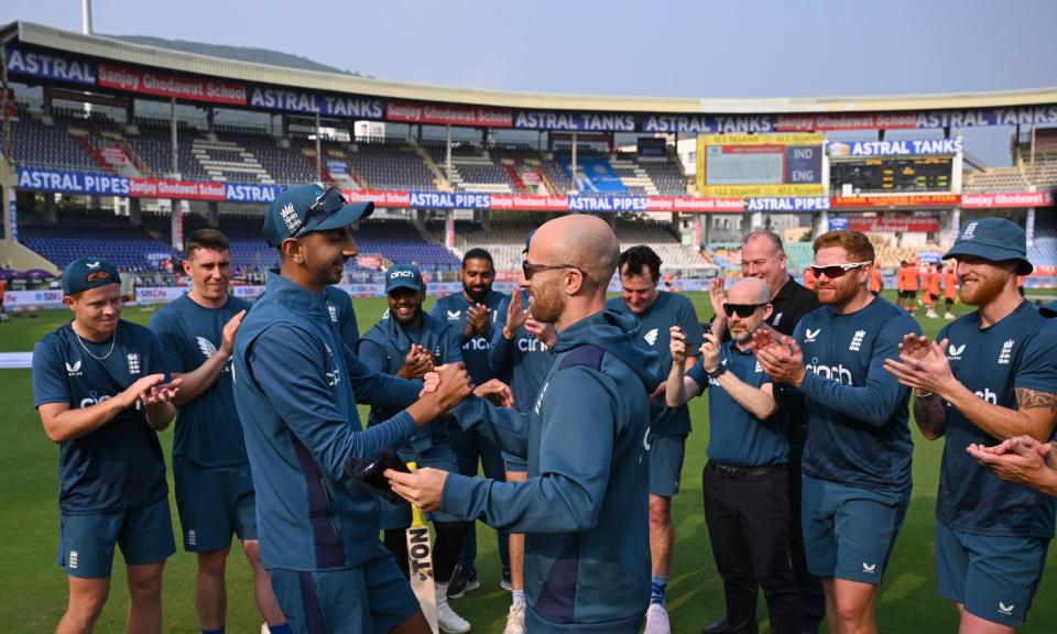 <span>England debutant Shoaib Bashir receives his Test cap from Jack Leach before the second Test against India.</span><span>Photograph: Stu Forster/Getty Images</span>