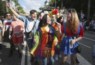 Participants march through a street during a pride parade in Taipei, Taiwan, Saturday, Oct. 31, 2020. (AP Photo/Chiang Ying-ying)