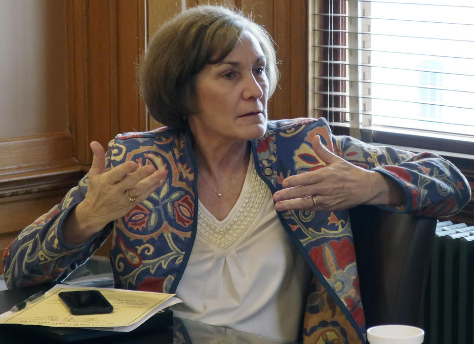 In this Wednesday, Feb. 13, 2019 photo, Kansas state Sen. Barbara Bollier, D-Mission Hills, makes a point during a meeting of Democratic senators at the Statehouse in Topeka, Kansas. Bollier opposes a resolution condemning New York's new abortion law that is moving through the Kansas Legislature. (AP Photo/John Hanna)
