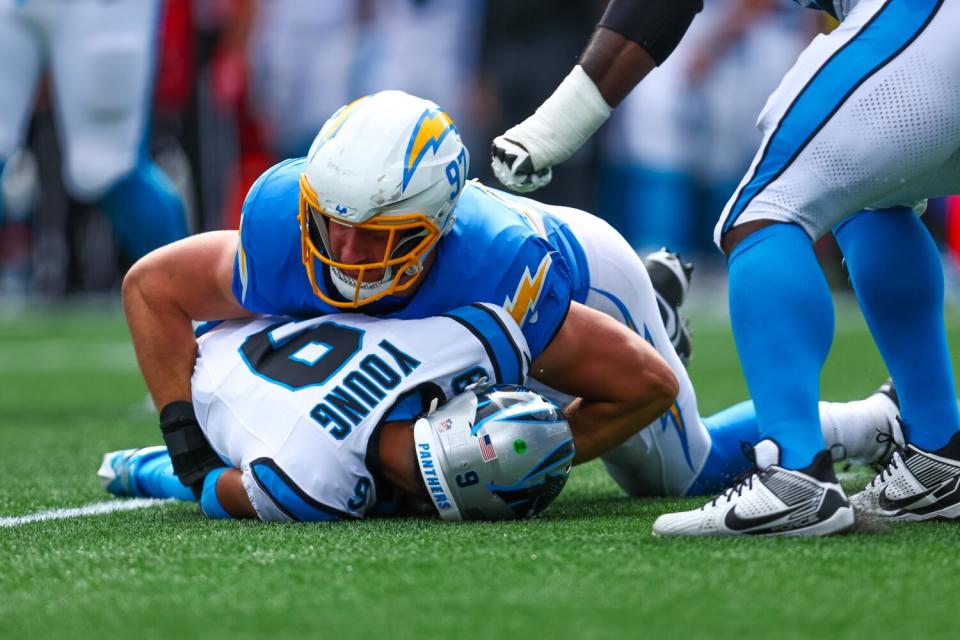 The Chargers' Joey Bosa (97) sacks Panthers quarterback Bryce Young.