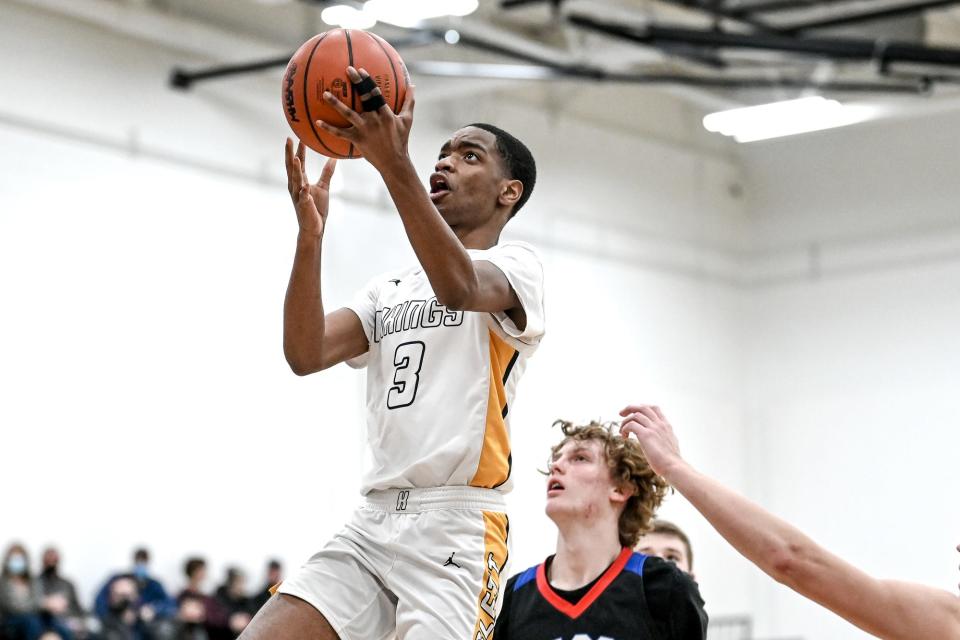 Haslett's Thomas Dodd scores against Mason during the third quarter on Friday, Jan. 21, 2022, in Lansing.