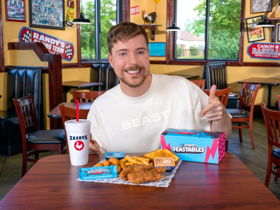 Jimmy Donaldson, also known as MrBeast, enjoys his meal at Zaxby's.