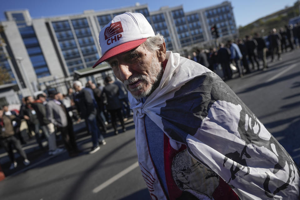 FILE - A supporter of Istanbul Mayor Ekrem Imamoglu, demonstrates in front of Anadolu courthouse in Istanbul, Turkey, Friday, Nov. 11, 2022. (AP Photo/Khalil Hamra, File)