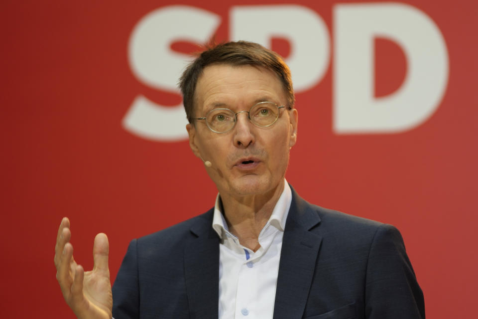 Designated new German Health Minister Karl Lauterbach of the Social Democratic Party, SPD, speaks during a news conference at the party's headquarters in Berlin, Germany, Monday, Dec. 6, 2021. German parliament Bundestag is planning to elect Olaf Scholz of the SPD as new chancellor on Wednesday Dec. 8, 2021. (AP Photo/Markus Schreiber)