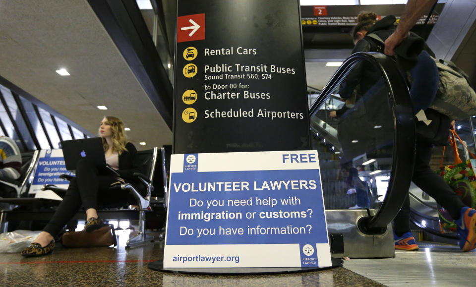 <p> Asti Gallina, left, a volunteer law student from the University of Washington, sits at a station near where passengers arrive on international flights at Seattle-Tacoma International Airport Tuesday, Feb. 28, 2017, in Seattle. Gallina was volunteering with the group Airport Lawyer, which also offers a secure website and mobile phone app that alerts volunteer lawyers to ensure travelers make it through customs without trouble. Airport officials and civil rights lawyers around the country are getting ready for President Donald Trump's new travel ban, which is expected to be released as soon as Wednesday. (AP Photo/Ted S. Warren) </p>