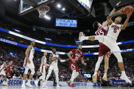 <p>Chuma Okeke #5 of the Auburn Tigers battles for a rebound with Ivan Aurrecoechea #15 of the New Mexico State Aggies during the first half in the first round of the 2019 NCAA Men’s Basketball Tournament at Vivint Smart Home Arena on March 21, 2019 in Salt Lake City, Utah. (Photo by Tom Pennington/Getty Images) </p>