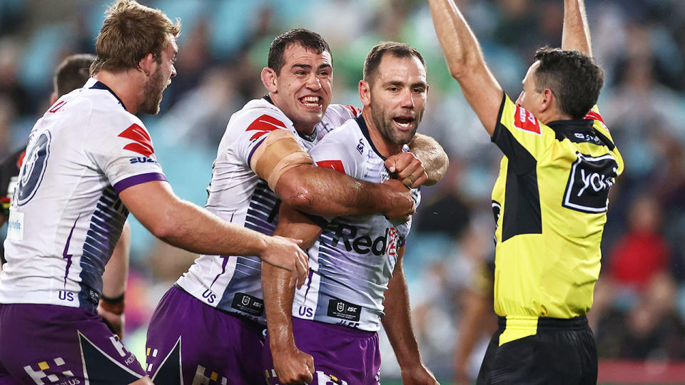 Pictured here, Cameron Smith celebrates his grand final try.