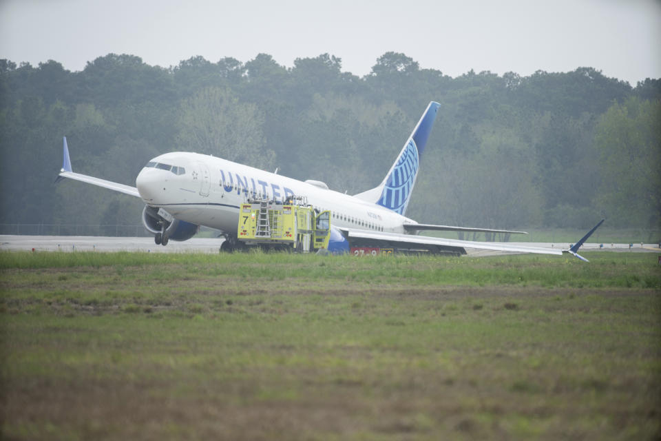 A United Airlines jet sits in a grassy area after leaving the taxiway Friday, March 8, 2024, at George Bush Intercontinental Airport in Houston. No passenger or crew injuries have been reported, according to a United Airlines spokesperson. (Jason Fochtman/Houston Chronicle via AP)