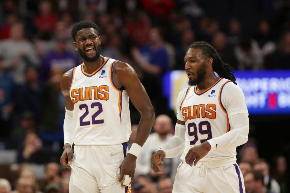 Phoenix Suns center Deandre Ayton (22) reacts after getting a technical foul with Suns forward Jae Crowder (99) during an NBA basketball game against the Minnesota Timberwolves Wednesday, March 23, 2022, in Minneapolis.