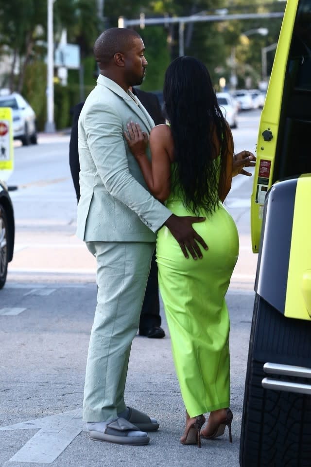 Kim Kardashian gets a helping hand from her man Kanye West while they grab ice cream.