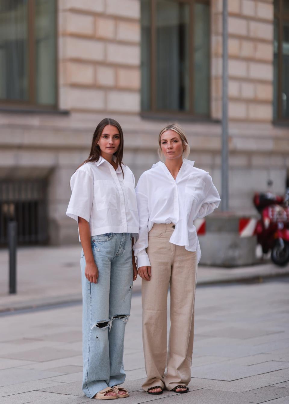 <p>Keep things business-casual in crisp white button-down shirts and comfy slides. Layer on gold bangles or simple necklaces for a little glimmer.</p>