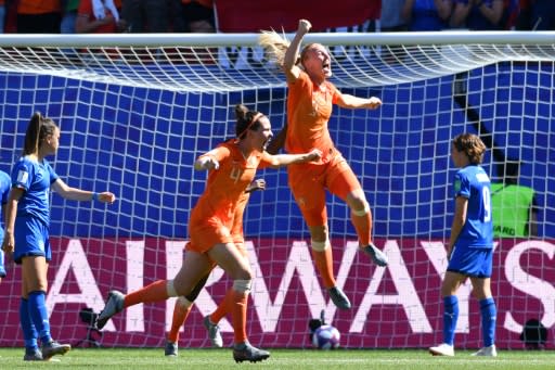 Netherlands sank Italy 2-0 with goals from Vivianne Miedema and Stefanie van der Gragt (2R)taking them to their first ever World Cup semi-final in just their second appearance at the tournament