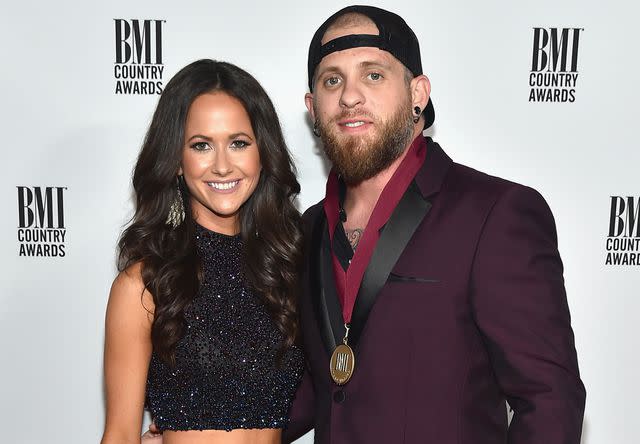 <p>Michael Loccisano/Getty</p> Brantley Gilbert and Amber Cochran attend the 64th Annual BMI Country awards on November 1, 2016 in Nashville, Tennessee.