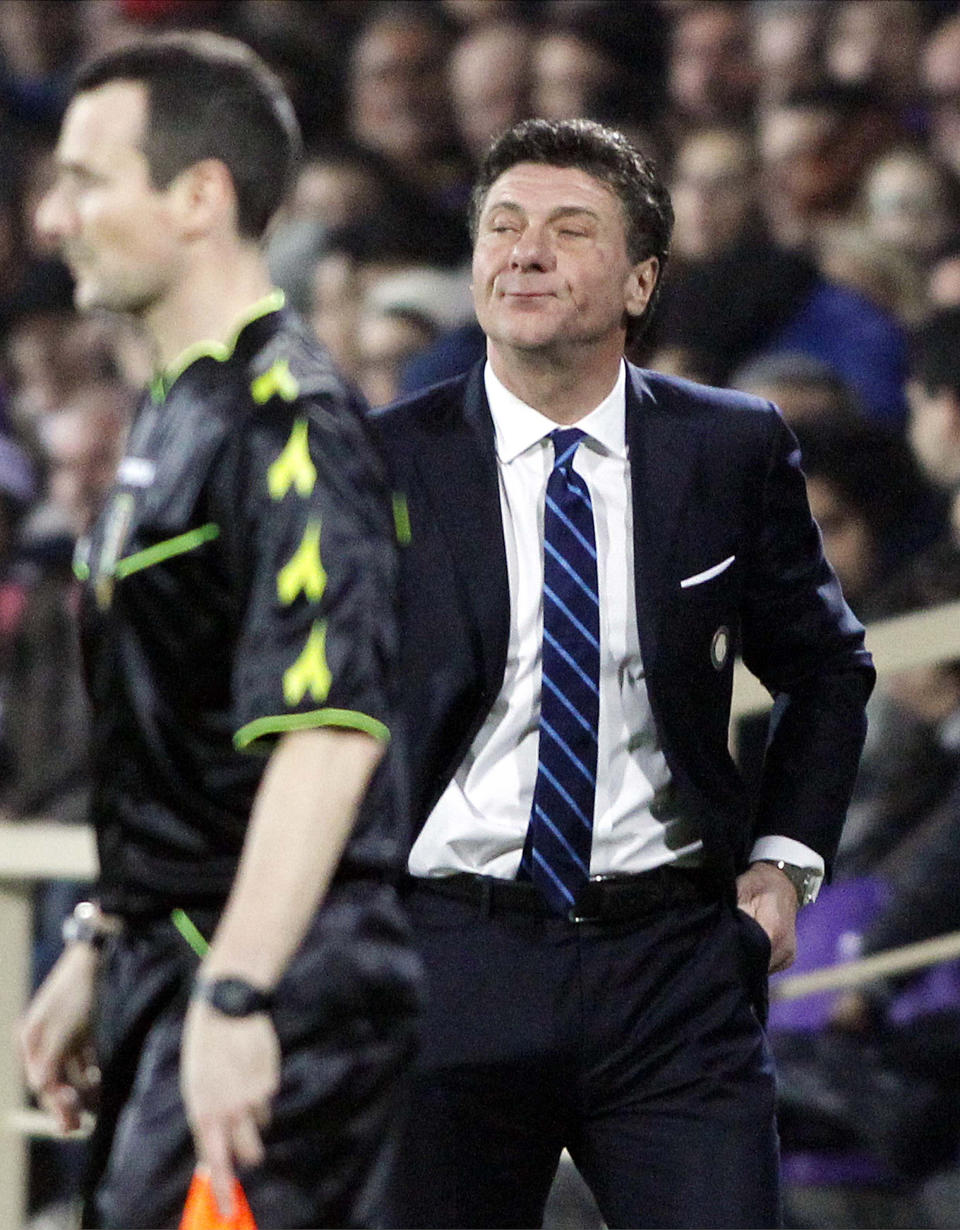Inter Milan's coach Walter Mazzarri, right, follows the game during a Serie A soccer match between Fiorentina and Inter Milan, at the Artemio Franchi stadium in Florence, Italy, Saturday, Feb. 15, 2014. (AP Photo/Fabrizio Giovannozzi)