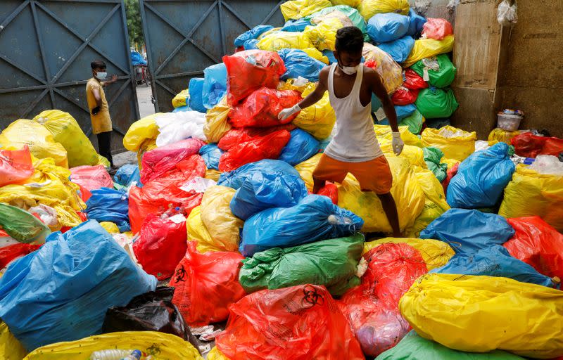 The Wider Image: "Fear will not fill our bellies": why Indian scavengers risk their lives amid coronavirus debris