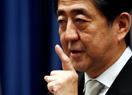 Japan's Prime Minister Shinzo Abe speaks during a news conference at his official residence in Tokyo December 24, 2014. REUTERS/Thomas Peter/File Photo