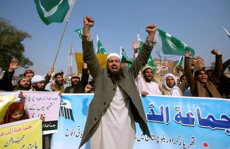 Supporters of Islamic charity organization Jamaat-ud-Dawa (JuD), chant slogans to condemn the house arrest of Hafiz Muhammad Saeed, chief of (JuD), during a protest demonstration in Peshawar, Pakistan, January 31, 2017. REUTERS/Fayaz Aziz