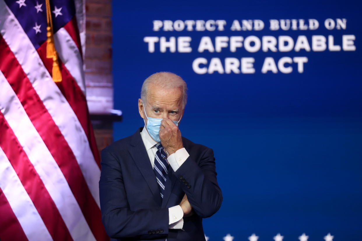 President-elect Joe Biden adjusts his face mask after delivering remarks about health care and the ACA in Wilmington, Delaware, November 10, 2020. REUTERS/Jonathan Ernst