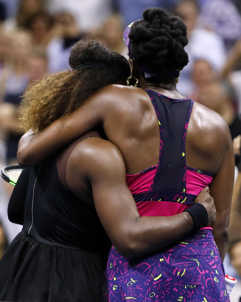 FILE - In this Friday, Aug. 31, 2018, file photo, Serena Williams, left, embraces her sister Venus Williams after their third-round match at the U.S. Open tennis tournament in New York. Serena Williams won 6-1, 6-2. The siblings meet each other for the 31st time when they take the court at a WTA tournament in Kentucky on Thursday, Aug. 13, 2020. (AP Photo/Adam Hunger, File)
