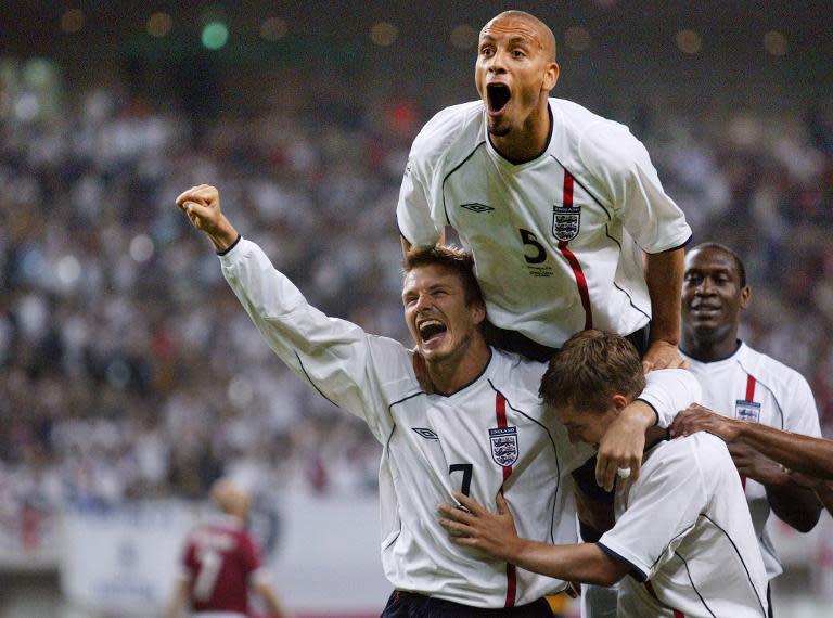 Rio Ferdinand (C) was capped 81 times for England and is pictured here at the 2002 World Cup with teammates Michael Owen (R) and David Beckham (L)