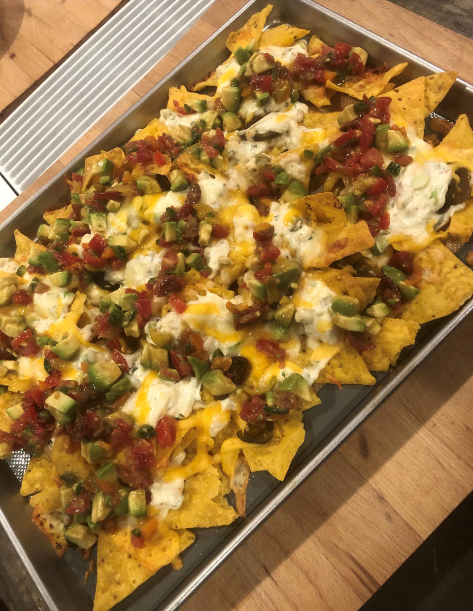 My husband couldn't get enough of these nachos — even with half the suggested amount of crabmeat. (Kavita Varma White)