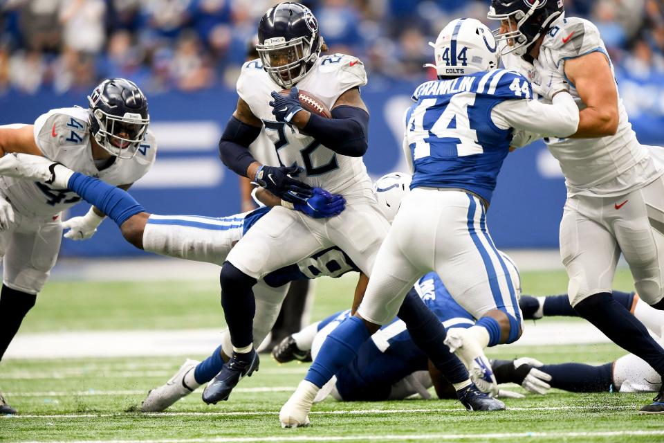 Tennessee Titans running back Derrick Henry (22) runs the ball during overtime at Lucas Oil Stadium Sunday, Oct. 31, 2021 in Indianapolis, Ind. 