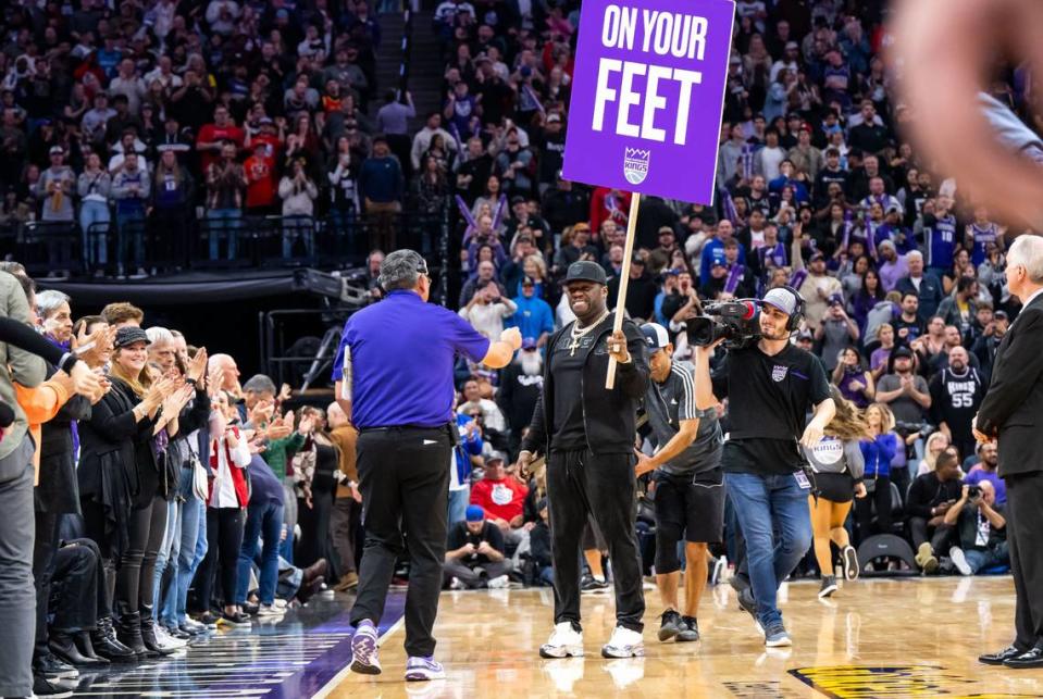 Rapper, businessman and actor 50 Cent (Curtis Jackson) motivates the home crowd with a sign between quarters as the Sacramento Kings host the Indiana Pacers at the NBA basketball game Wednesday, Nov. 30, 2022, at Golden 1 Center in Sacramento. Xavier Mascareñas/xmascarenas@sacbee.com