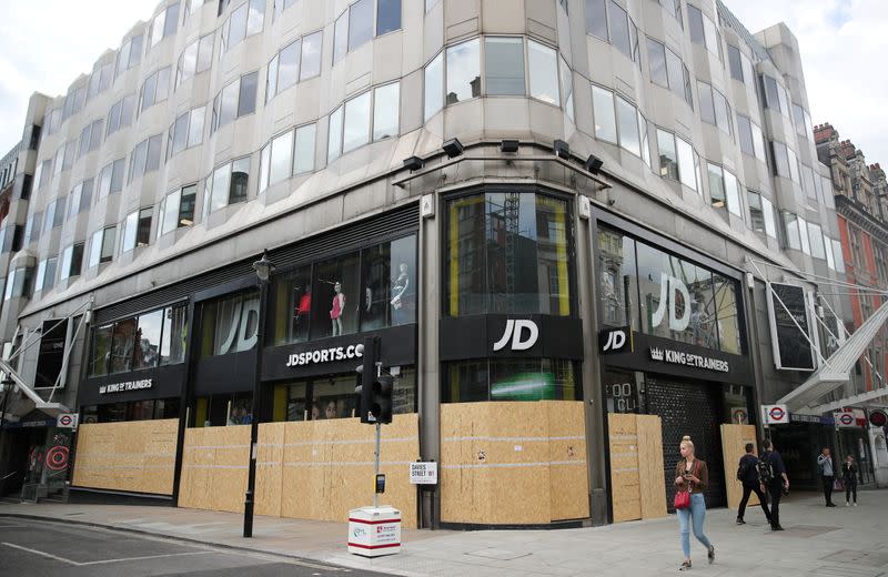 FILE PHOTO: Shops are seen boarded up in Oxford Street, in London