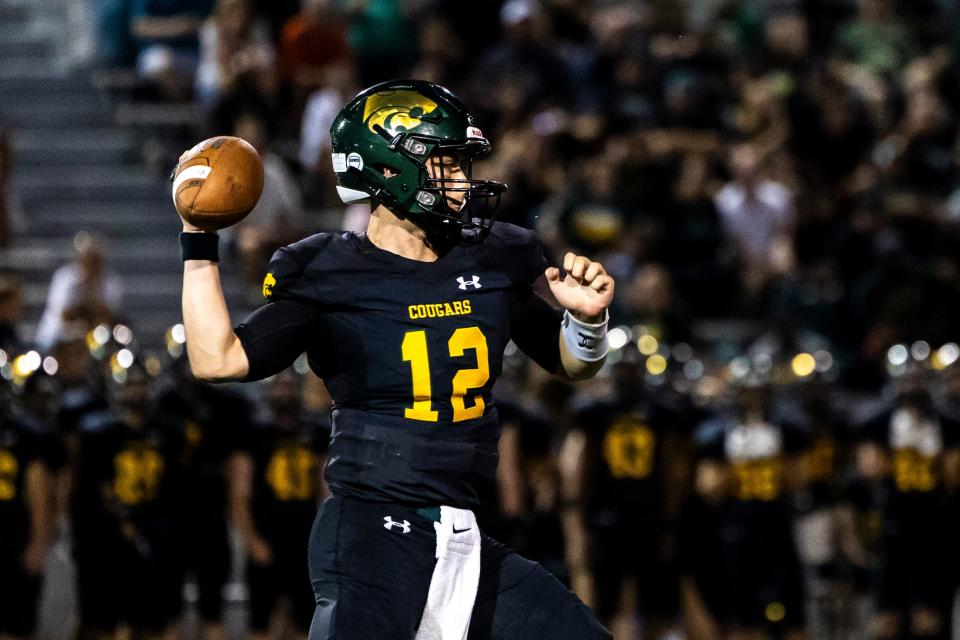 Cedar Rapids Kennedy's Vincenzo Gianforte (12) passes against Dowling Catholic on Aug. 26 at Kingston Stadium in Cedar Rapids.