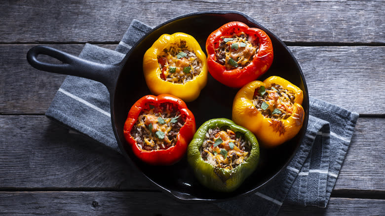 Colorful stuffed peppers in cast iron skillet