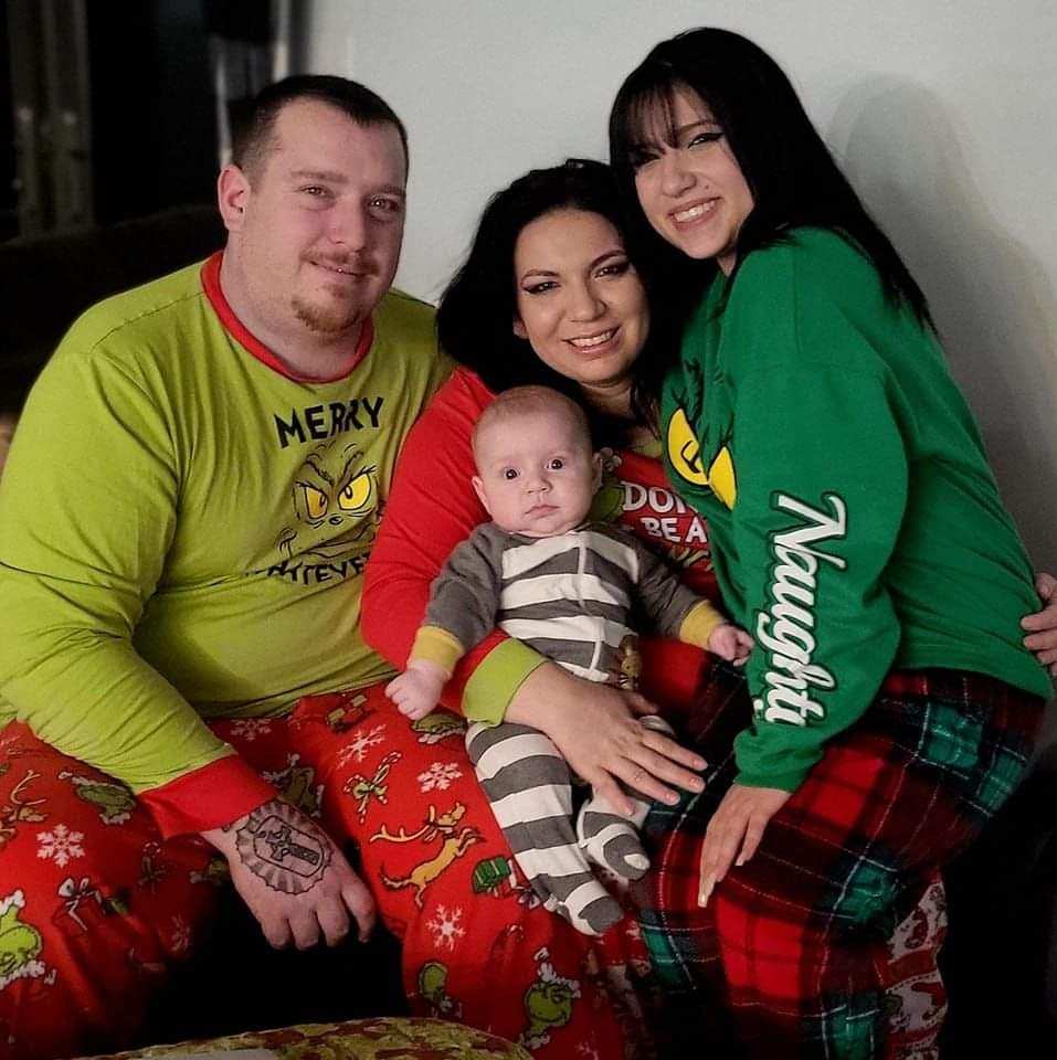 Brittany Ingle (center) with her husband, daughter and son.