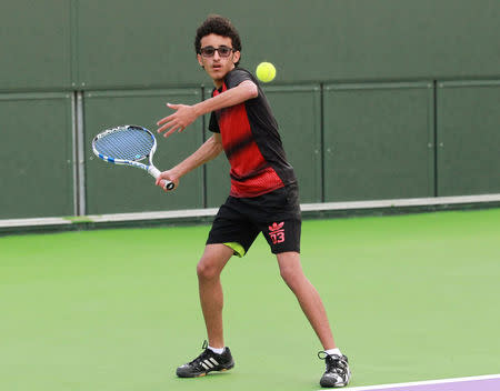 Suhail Alsaeedi from Sanaa, 13, takes part in a training session at Khalifa International Tennis and Squash Complex in Doha, Qatar, March 2, 2017. Picture taken March 2, 2017. REUTERS/Naseem Zeitoon