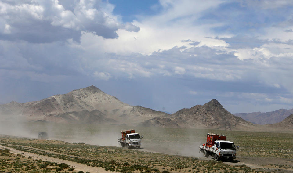 <p>Trucks carrying Przewalski’s horses drive to Takhin Tal National Park, part of the Great Gobi B Strictly Protected Area, in south-west Mongolia, June 20, 2017. (Photo: David W. Cerny/Reuters) </p>