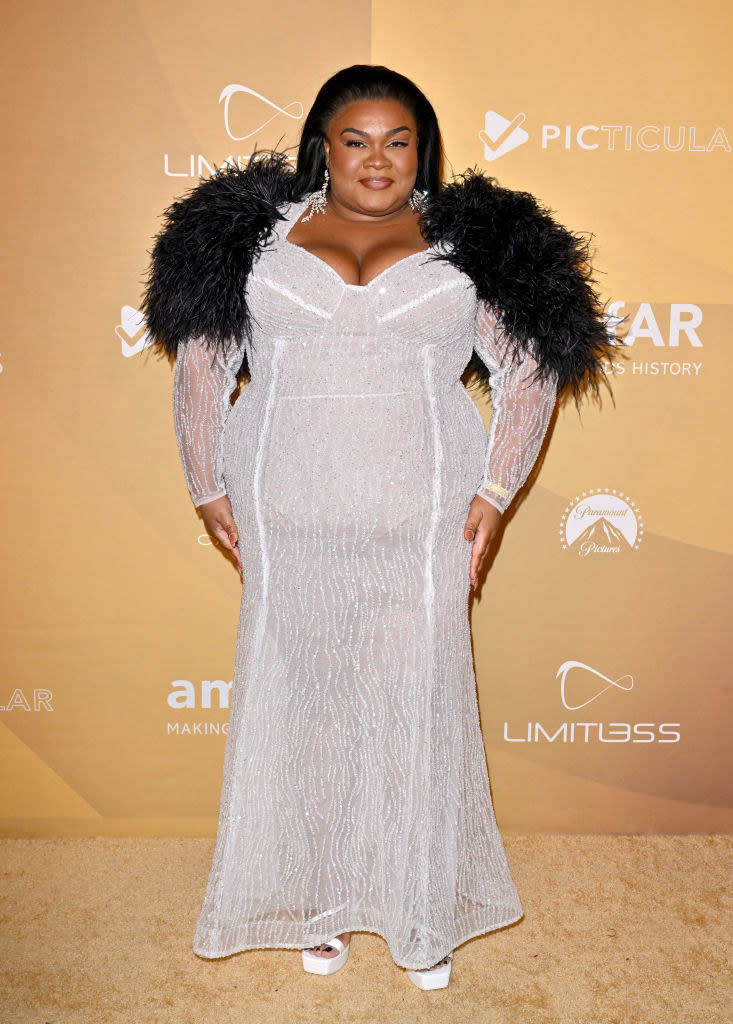 Da'Vine Joy Randolph wore a sequined see-through dress with feathered shoulders