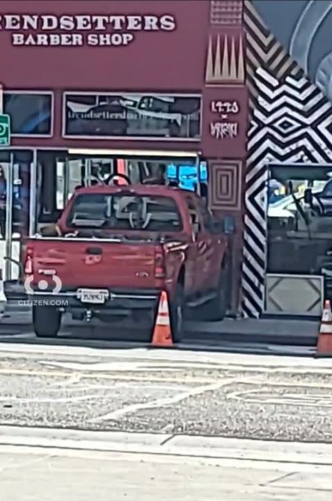 Surveillance video captures the frightening moment a pickup truck crashes through a West Hollywood barber shop, narrowly missing customers inside on Nov. 16, 2023. (Citizen)