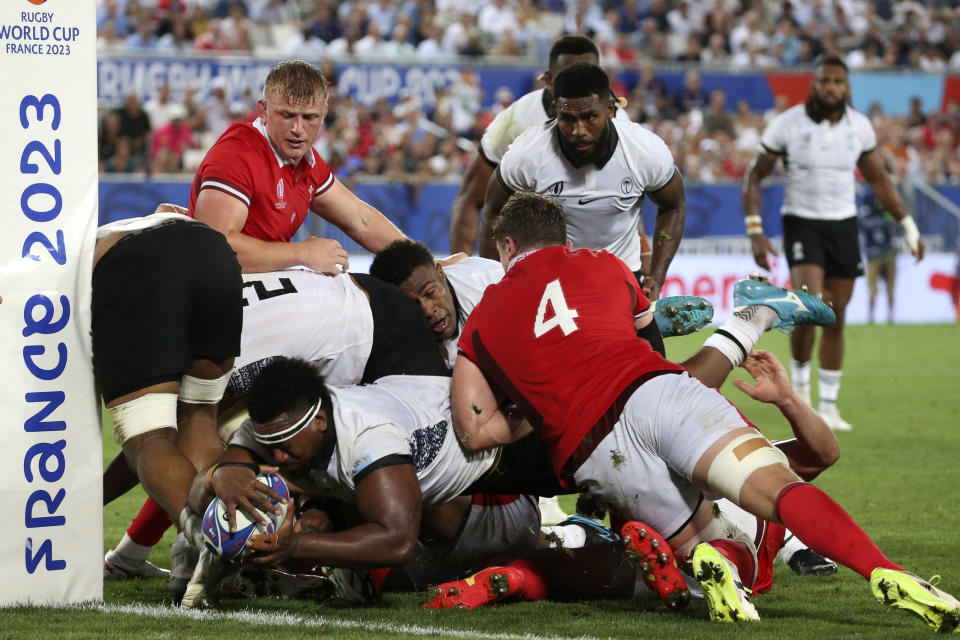 Fiji's Vinaya Habosi scores a try, disallowed by the referee during the Rugby World Cup Pool C match between Wales and Fiji at the Stade de Bordeaux in Bordeaux, France, Sunday, Sept. 10, 2023. (AP Photo/Bob Edme)