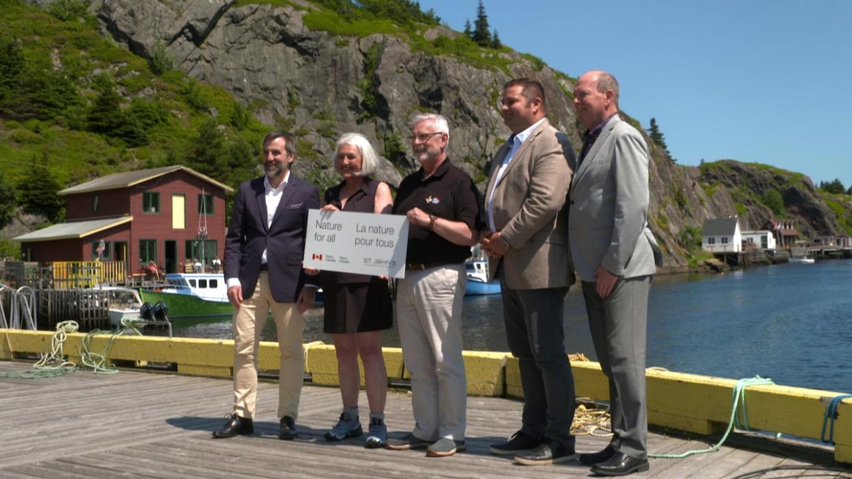 From left: Federal Environment Minister Steven Guilbeault, Liberal MP Joanne Thompson, St. John's Mayor Danny Breen, Newfoundland and Labrador Environment Minister Bernard Davis and St. John's East-Quidi Vidi MHA John Abbott announced a commitment to explore creating a national urban park in the city on Monday. (Mark Cumby/CBC - image credit)