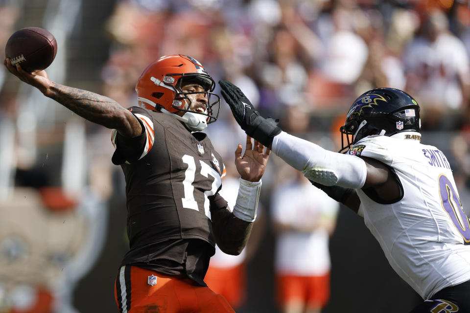 Cleveland Browns quarterback Dorian Thompson-Robinson (17) passes as Baltimore Ravens linebacker Roquan Smith (0) pressures during the second half of an NFL football game, Sunday, Oct. 1, 2023, in Cleveland. (AP Photo/Ron Schwane)