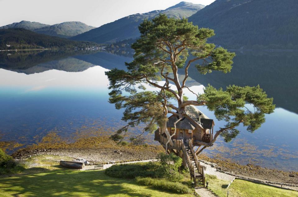 <p>Here's an excellent excuse to hop across the pond. This dreamy Scottish cottage overlooks an incredibly scenic loch and has hosted hundreds of weddings (it's easy to see why!).</p><p><a class="link " href="https://go.redirectingat.com?id=74968X1596630&url=https%3A%2F%2Fwww.tripadvisor.com%2FHotel_Review-g315997-d305519-Reviews-The_Lodge_on_Loch_Goil-Loch_Goil_Argyll_and_Bute_Scotland.html&sref=https%3A%2F%2Fwww.housebeautiful.com%2Fdesign-inspiration%2Fhouse-tours%2Fg3301%2Famazing-tree-house-homes%2F" rel="nofollow noopener" target="_blank" data-ylk="slk:BOOK NOW;elm:context_link;itc:0;sec:content-canvas">BOOK NOW</a> <strong><em>Treehouse on Loch Goil</em></strong></p>
