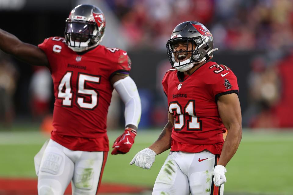 Tampa Bay Buccaneers safety Antoine Winfield Jr. (31) and linebacker Devin White (45) celebrate after sftopping the Buffalo Bills during the first half of an NFL football game Sunday, Dec. 12, 2021, in Tampa, Fla.