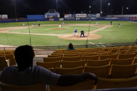 Fans attend a baseball game between Los Maceteros de Vega Alta and Los Atenienses de Manati during the Puerto Rico Double A baseball league at Manati, Puerto Rico, June 6, 2016. REUTERS/Alvin Baez