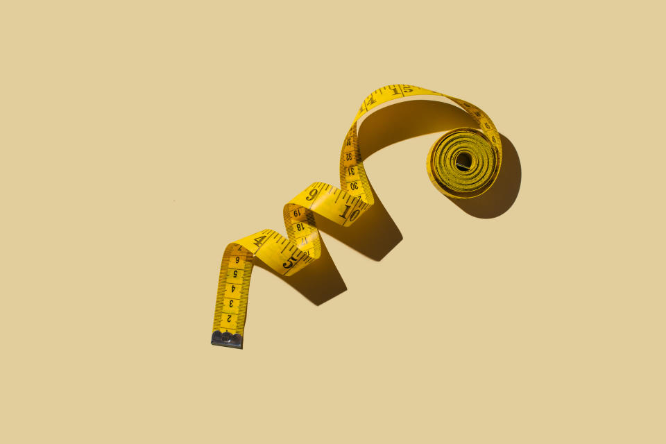 Different ways in which people experience stress and anxiety, whether it's nausea or a lack of sleep, have varied consequences on the body and its metabolism. Measuring tapes on beige background